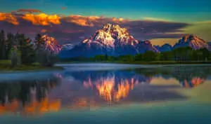 sunrise over the grand teton mountains