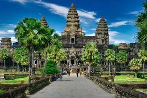 Angkor Wat Surrounded By Nature Beneath Blue Sky
