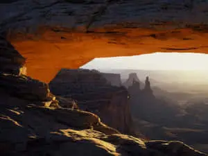 a view of the canyon through an arch