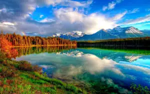 a lake surrounded by mountains and trees