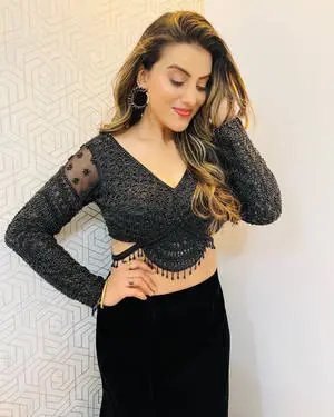 Bhojpuri Cinema Star Radiating Charm in Black Patterned Outfit
