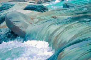A clean blue river cascading through the landscape