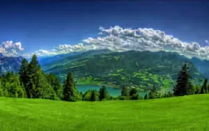 An awe-inspiring view of a golden sunrise overlooking a valley of rolling hills.