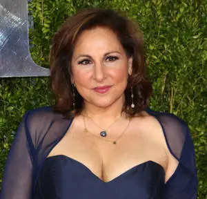 Renowned actress Kathy Najimy strikes a pose in a classic navy blue satin dress.