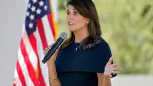 Nikki Haley delivering a speech holding a microphone