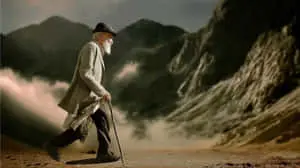 Wise Wanderer Amidst Majestic Mountainous Landscapes	